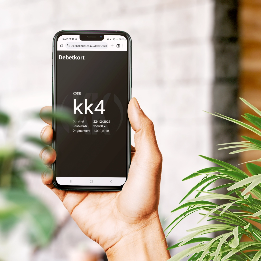 mobiltelefonen-viser-debetkortet